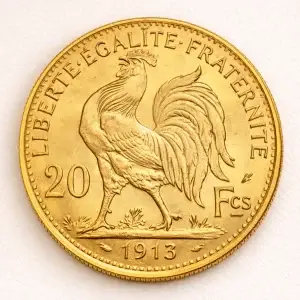 French 20 Franc gold coin on a light premium studio background