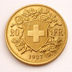 Swiss 20 Franc gold coin on a light premium studio background
